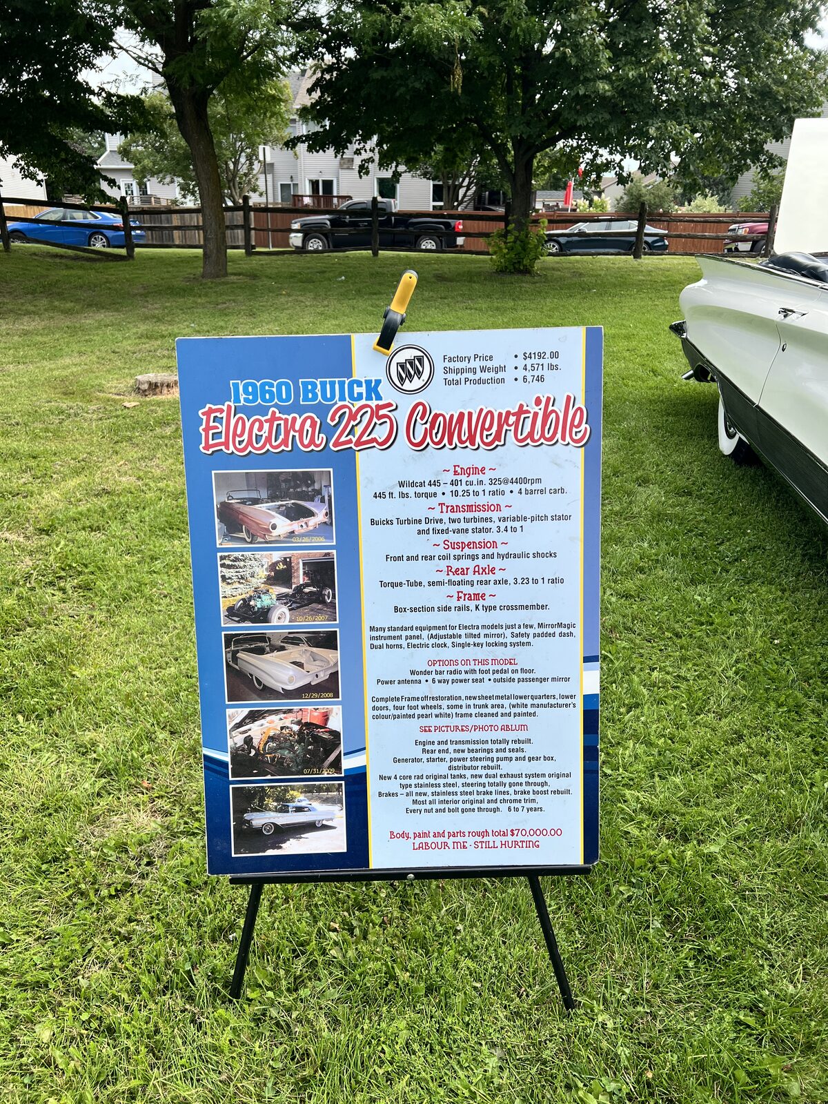 A display board headed 1960 Buick Electra 225 Convertible, listing factory price, engine and restoration details beside five photographs of the car mid-rebuild.