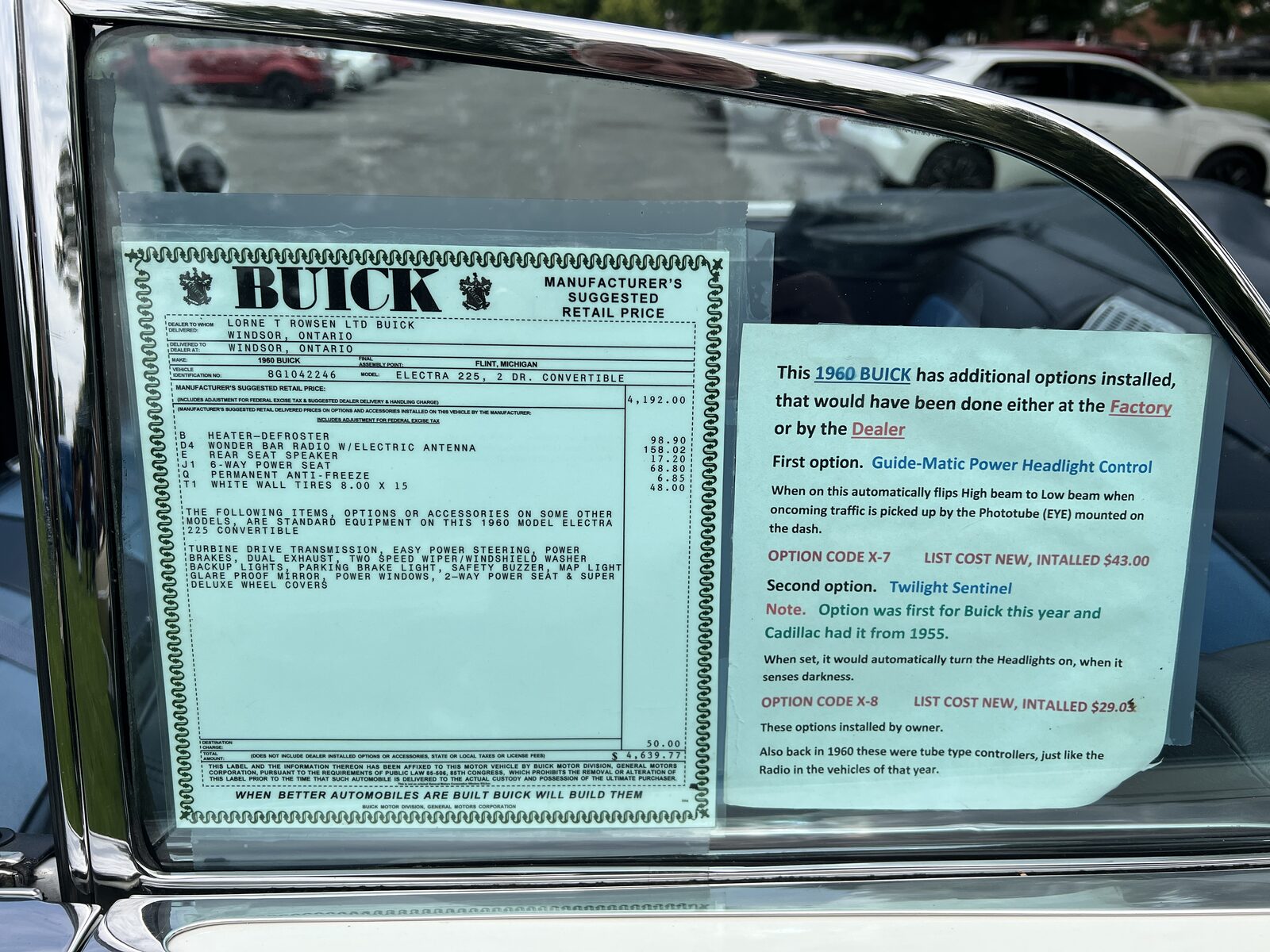 The original 1960 Buick manufacturer's suggested retail price sticker displayed inside the car's side window, listing options and a total of $4,639.77.
